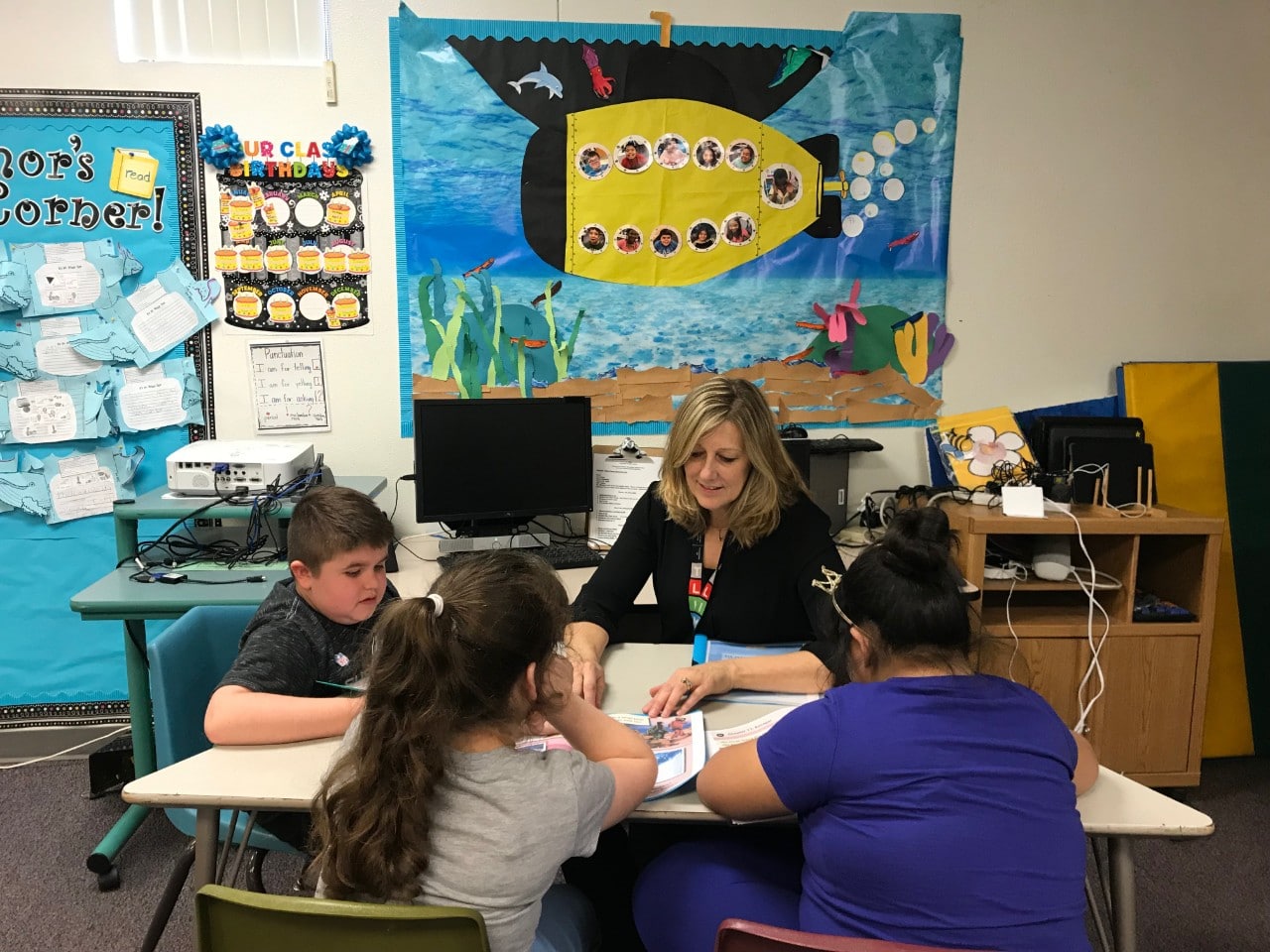 Patti Hummel working with her students in the classroom