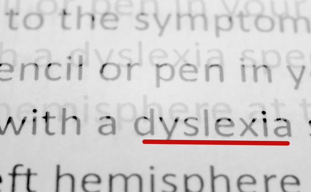 macro photography of the word dyslexia from the newspaper underlined in red marker
