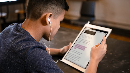 Student using an iPAD with a screen reader tool active